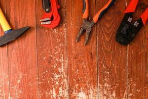 Flatly Building tools on a wooden background. Construction and repair. Fathers Day. Builders Day photo