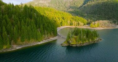 Aerial view of Harrison Lake and forest with mountain range in background video