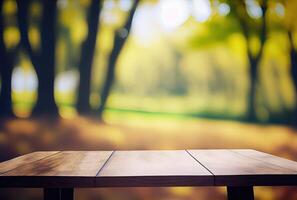 Empty table with blurry green natural park garden or backyard background. Nature and outdoor concept. photo