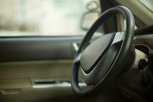 Steering wheel inside car. Rudder. photo