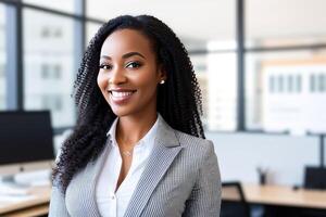 Young smiling businesswoman, standing in blur background of office. photo