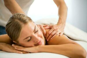 Woman enjoying a back massage photo