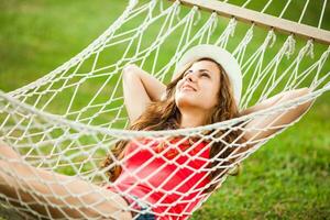 A young woman resting in a hammock photo