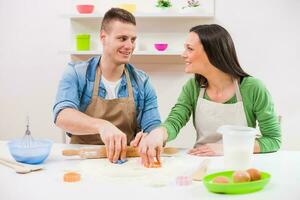 A couple cooking together photo