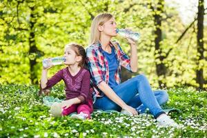 Mother and daughter spending time together outdoors photo