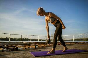 A woman doing physical exercises photo