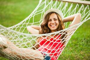 A young woman resting in a hammock photo