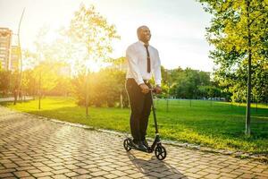 Afro businessman on a scooter photo