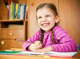 Little girl doing homework photo