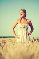 A woman in a wheat field photo