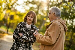 A senior couple spending time together in the park photo