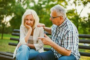 A senior couple spending time together in the park photo