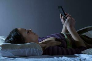 A young woman resting in the bed photo