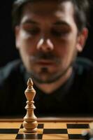 A man playing chess photo