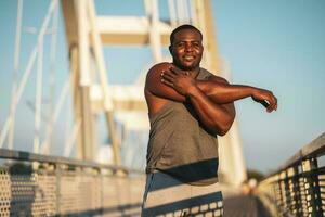 An African American man doing physical exercises photo