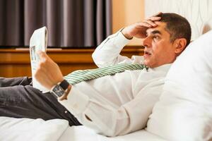 A businessman in a hotel room photo