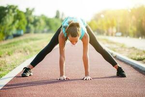 A woman on a running track photo