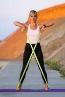 A woman doing physical exercises photo