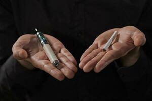 A man who is going to decide which cigarette he will smoke photo