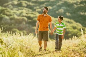 Father and son pending time outdoors photo