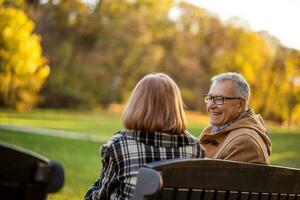 A senior couple spending time together in the park photo