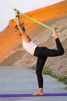 A woman doing physical exercises photo