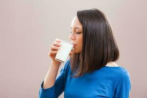 A woman drinking milk photo