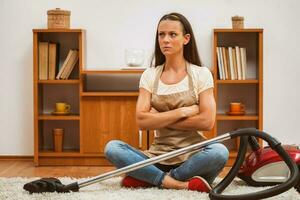 A woman cleaning the house photo