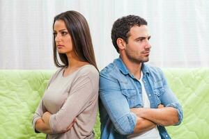 Portrait of a young couple arguing photo