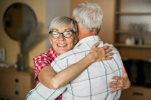 A senior couple hugging photo