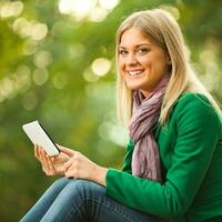 A woman reading a tablet photo