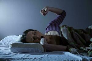 A young woman resting in the bed photo