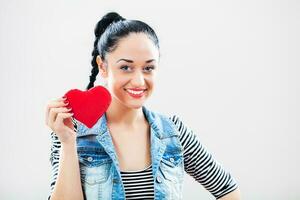 A woman holding a paper hearth photo