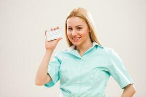 A nurse holding pills photo