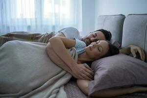 A young couple lying in bed photo