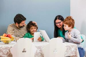 Parents are teaching their children to use the laptop photo