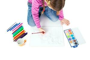 A little girl drawing photo