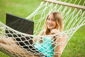 A young woman resting in a hammock photo