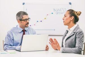 Business people discussing a business strategy photo