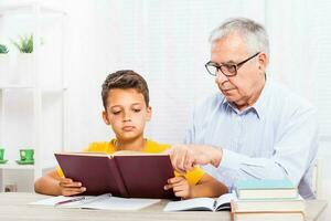 A grandfather spending time with his grandson photo