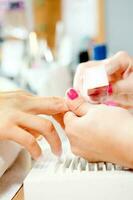 Nail treatment in a beauty salon photo