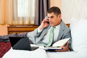 A businessman in a hotel room photo