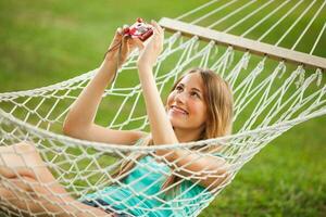 A young woman resting in a hammock photo