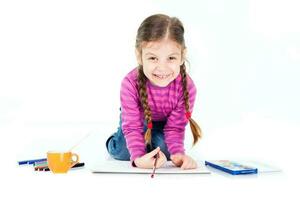 A little girl drawing photo