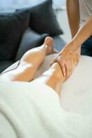 Woman enjoying a leg massage photo