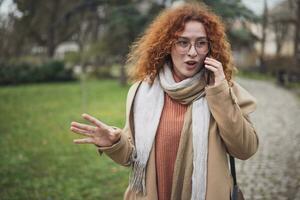 Portrait of a young woman with ginger hair photo