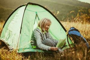 A senior woman camping photo