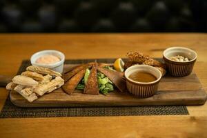 Baba ghanoush meal on wooden board. photo
