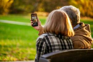 A senior couple spending time together in the park photo