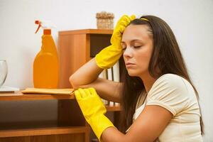 A woman cleaning the house photo